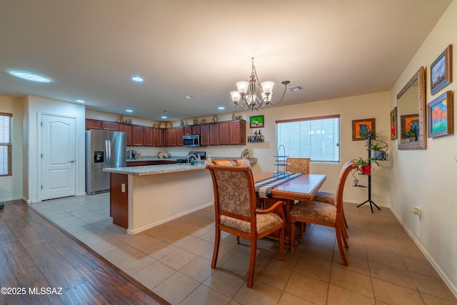 dining space with recessed lighting, visible vents, baseboards, a notable chandelier, and light tile patterned flooring