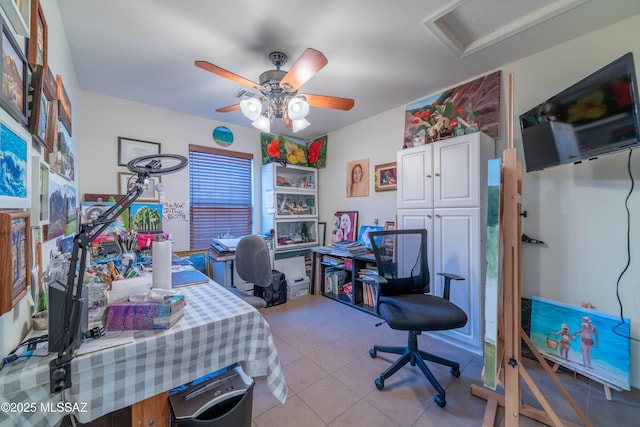 office space featuring ceiling fan and tile patterned floors