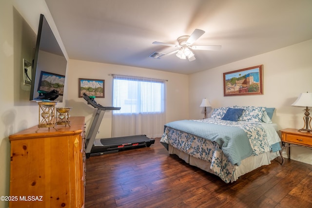 bedroom featuring visible vents, ceiling fan, and hardwood / wood-style flooring