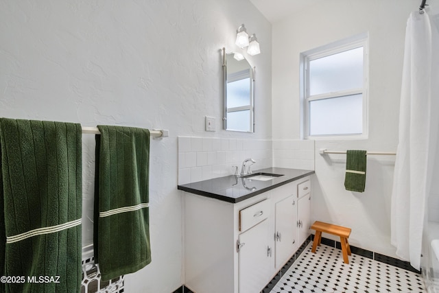 full bath with shower / tub combo, tasteful backsplash, and vanity