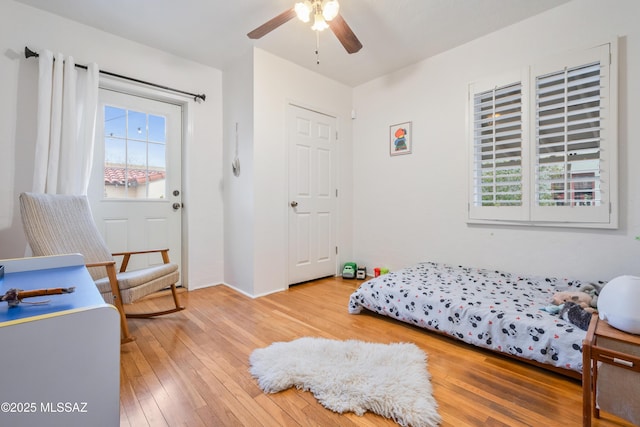 bedroom featuring ceiling fan and light wood-style flooring