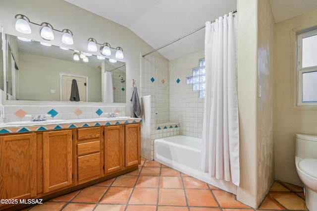 bathroom with toilet, lofted ceiling, tile patterned floors, shower / bathtub combination with curtain, and a sink