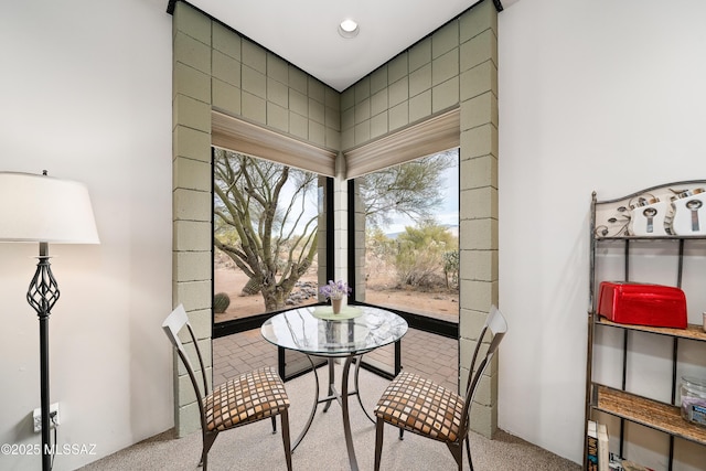 carpeted dining space featuring recessed lighting