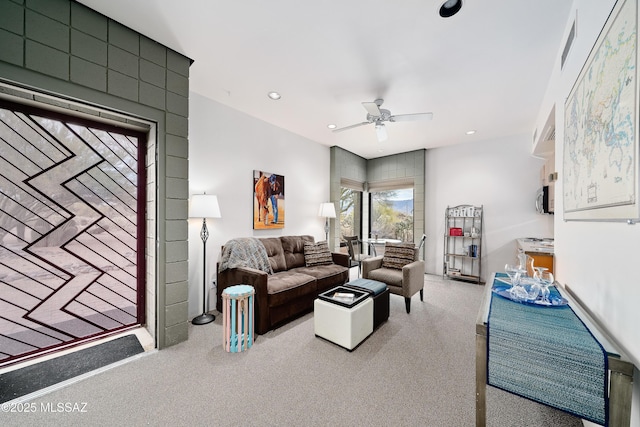 carpeted living area with recessed lighting, visible vents, and a ceiling fan