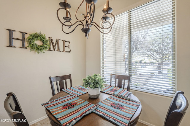 dining area featuring baseboards