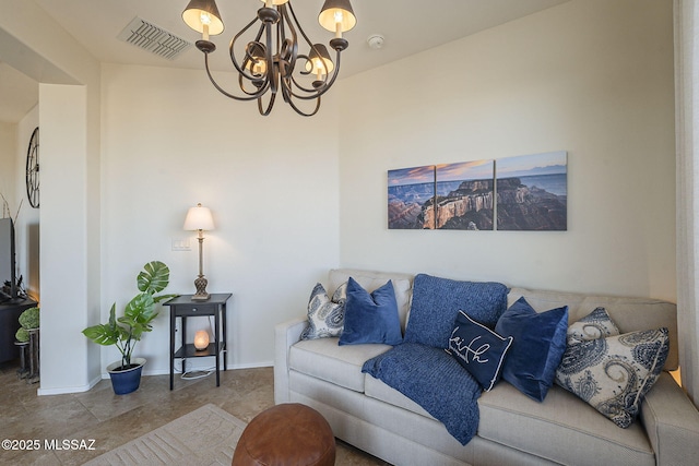 living room with visible vents, a notable chandelier, and baseboards