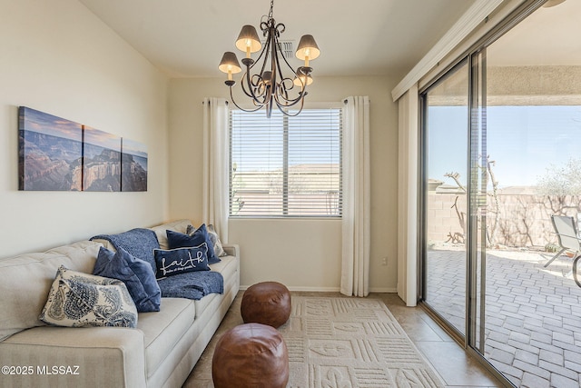 living room featuring light tile patterned flooring, a notable chandelier, and baseboards