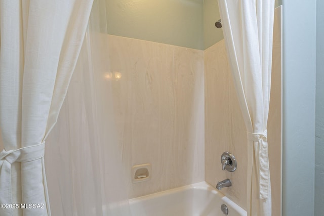 full bath featuring shower / bath combo with shower curtain