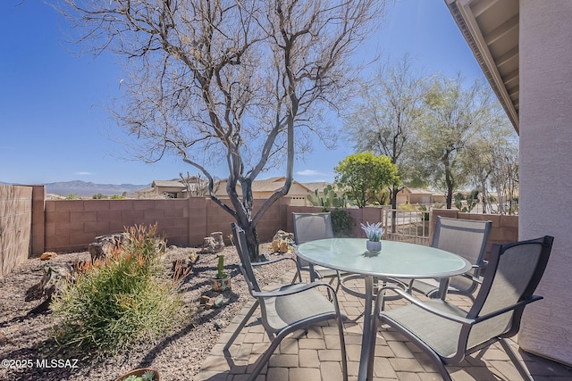 view of patio / terrace with outdoor dining area and a fenced backyard