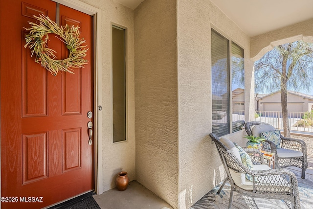 doorway to property with stucco siding