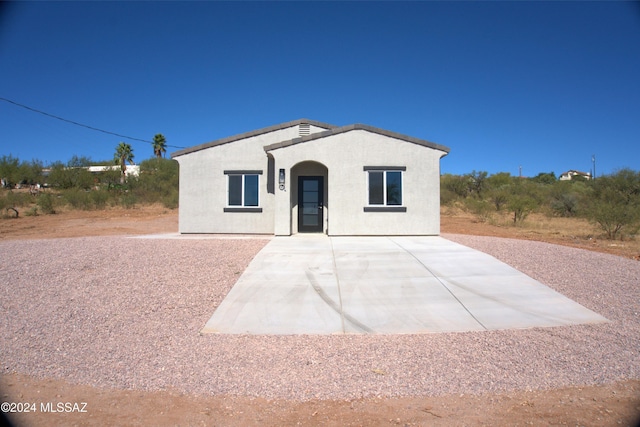 view of front of house featuring a patio and stucco siding