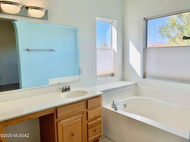 bathroom with a bath and vanity