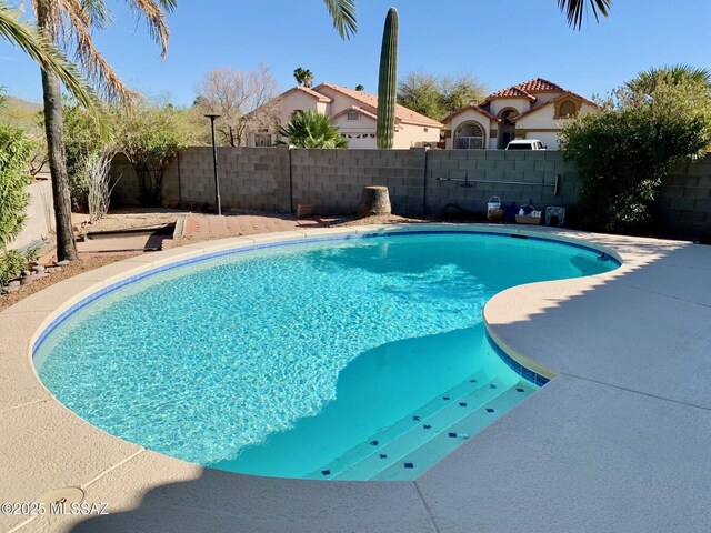 view of pool with a fenced in pool and a fenced backyard