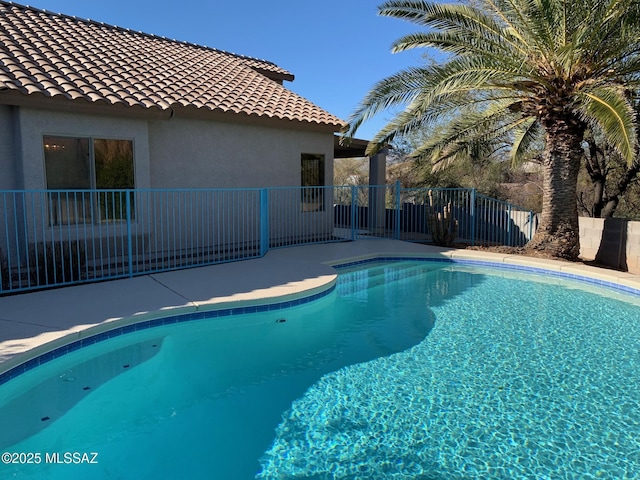 view of pool with fence and a fenced in pool