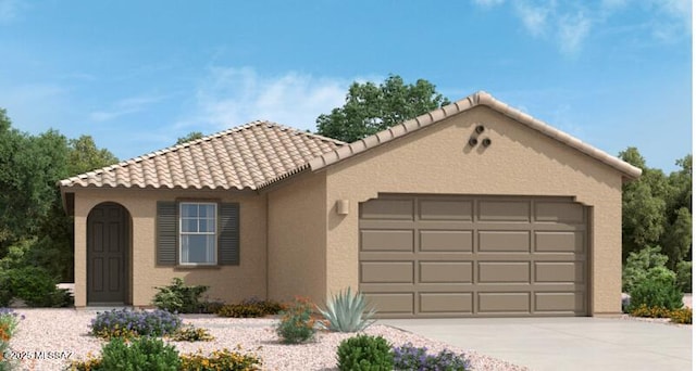 mediterranean / spanish home with an attached garage, a tiled roof, concrete driveway, and stucco siding