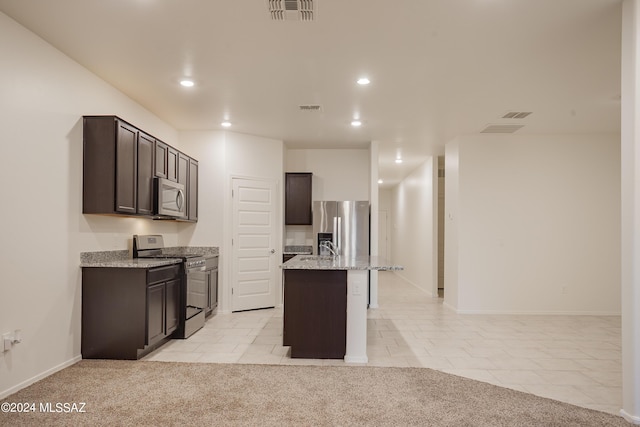 kitchen with light stone counters, stainless steel appliances, light colored carpet, visible vents, and dark brown cabinetry