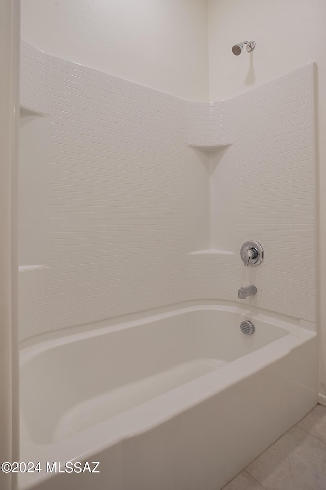 bathroom with shower / washtub combination and tile patterned flooring