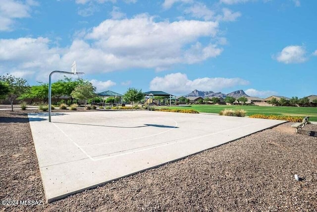 view of basketball court featuring community basketball court, a mountain view, and a gazebo