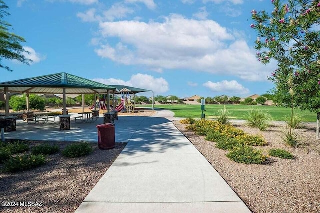 view of property's community with playground community and a gazebo