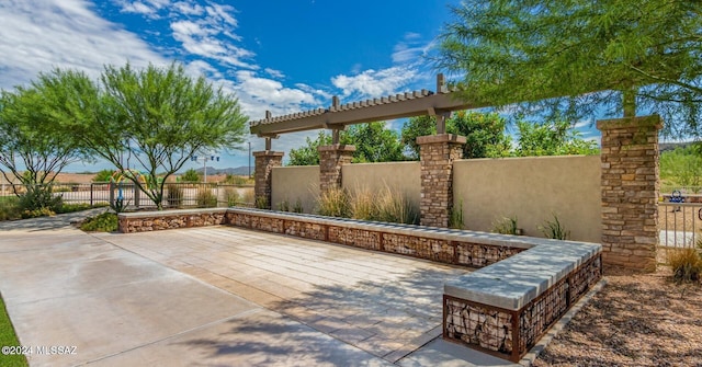 view of patio featuring fence