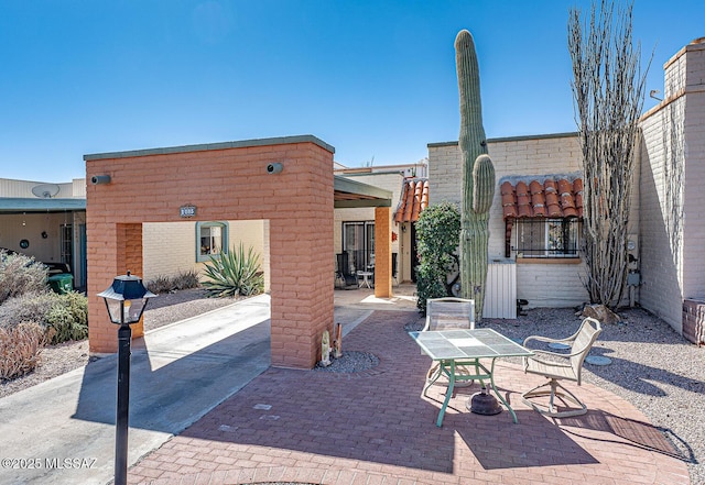 view of patio featuring outdoor dining area