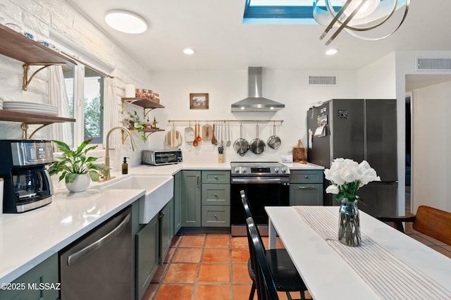 kitchen with visible vents, wall chimney range hood, light countertops, stainless steel appliances, and open shelves