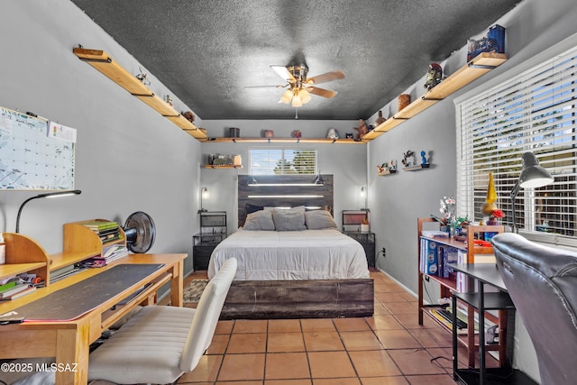 tiled bedroom featuring a textured ceiling