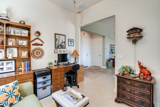 home office with light tile patterned floors and visible vents