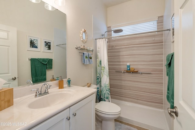 bathroom with toilet, curtained shower, and vanity