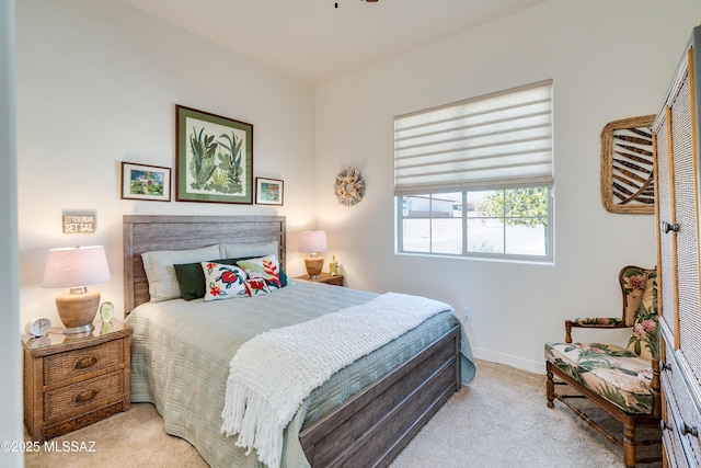 bedroom featuring carpet floors and baseboards