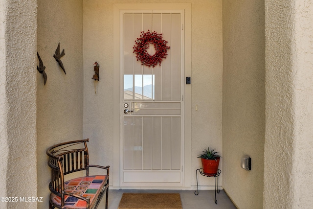 mediterranean / spanish home featuring a garage, a tile roof, driveway, and stucco siding