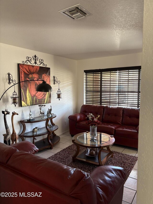 dining room featuring a notable chandelier and tile patterned flooring