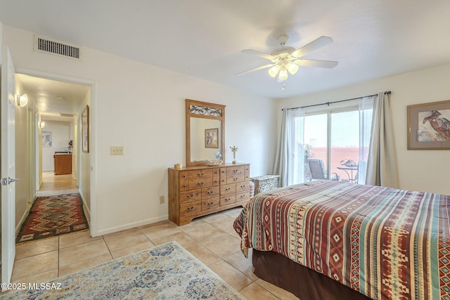 bedroom featuring light tile patterned floors, ceiling fan, visible vents, and baseboards