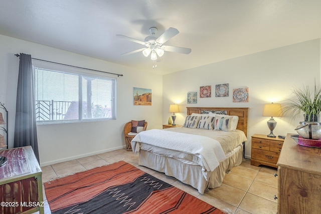 bedroom with light tile patterned floors, ceiling fan, and baseboards