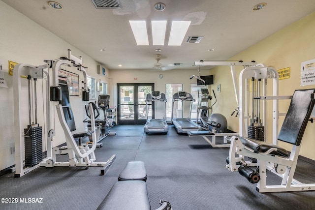 exercise room with french doors and visible vents