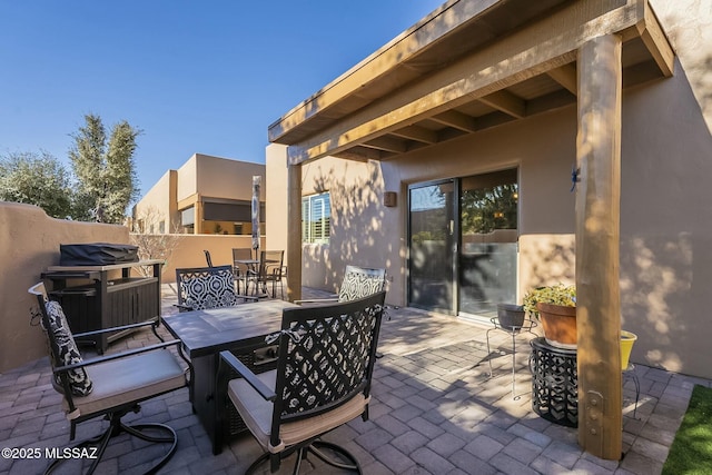 view of patio featuring fence and outdoor dining space