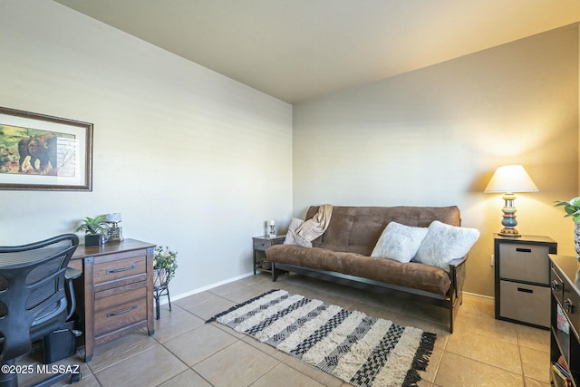 living room with light tile patterned flooring and baseboards