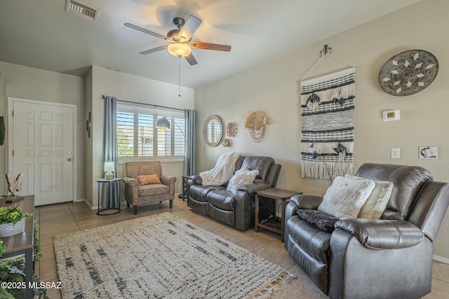 living area with a ceiling fan, tile patterned flooring, and visible vents