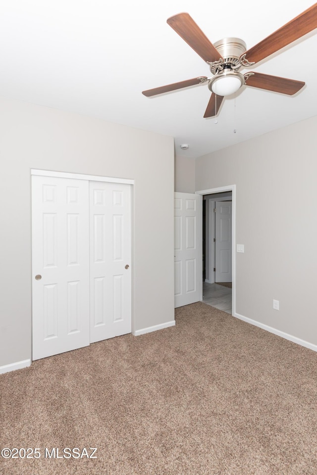 interior space with a closet, baseboards, and carpet floors