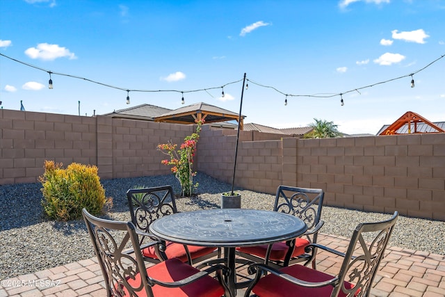 view of patio / terrace with a fenced backyard and outdoor dining space