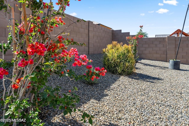 view of yard with a fenced backyard