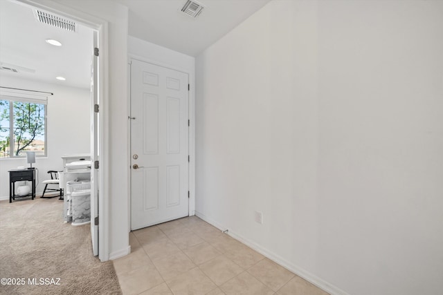 foyer entrance with baseboards, visible vents, and recessed lighting