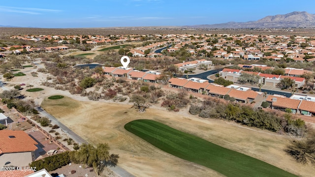 bird's eye view with a mountain view, view of golf course, and a residential view