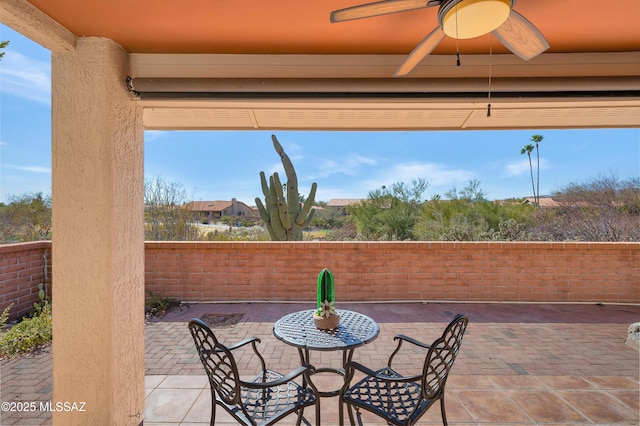 view of patio featuring ceiling fan