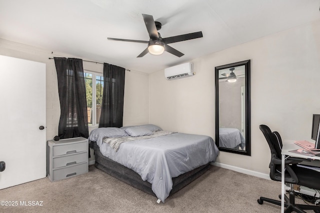 carpeted bedroom featuring a wall unit AC, ceiling fan, and baseboards