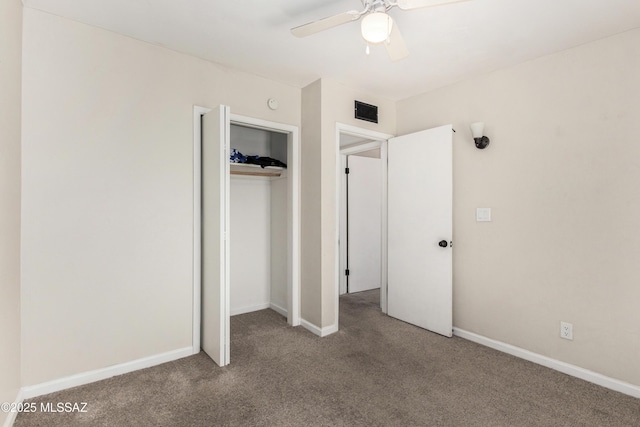 unfurnished bedroom with a closet, visible vents, baseboards, and carpet flooring