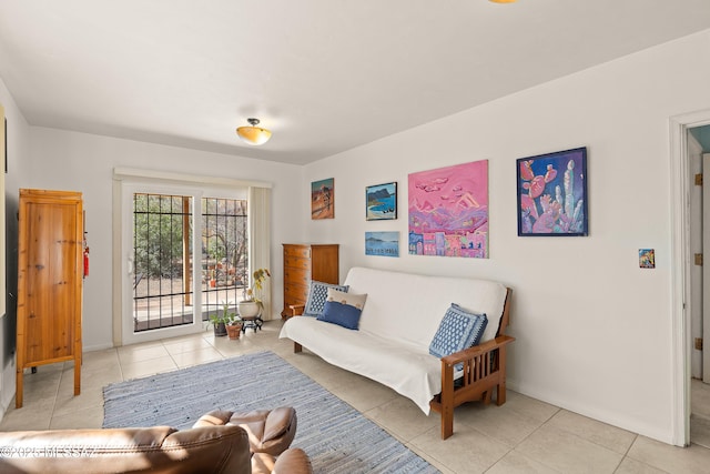 tiled bedroom with access to exterior and baseboards