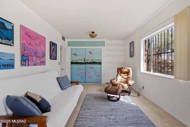 sitting room with light tile patterned floors and visible vents