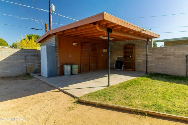 back of house with fence