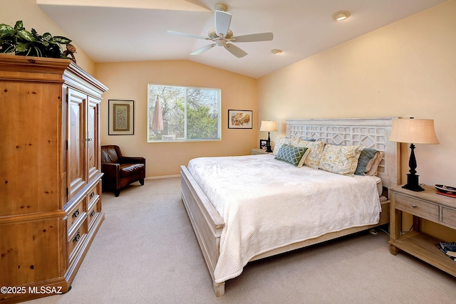 bedroom featuring lofted ceiling, light carpet, ceiling fan, and baseboards